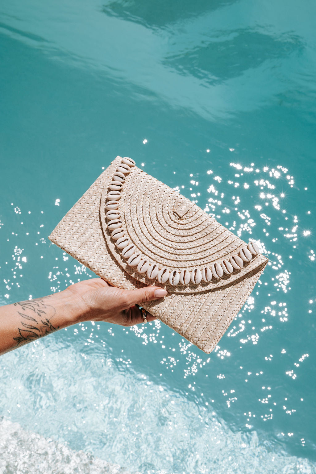 Sandi Cowrie Clutch