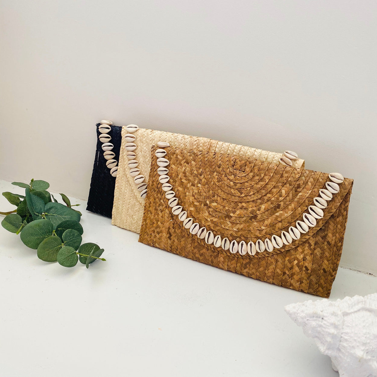 Sandi Cowrie Clutch