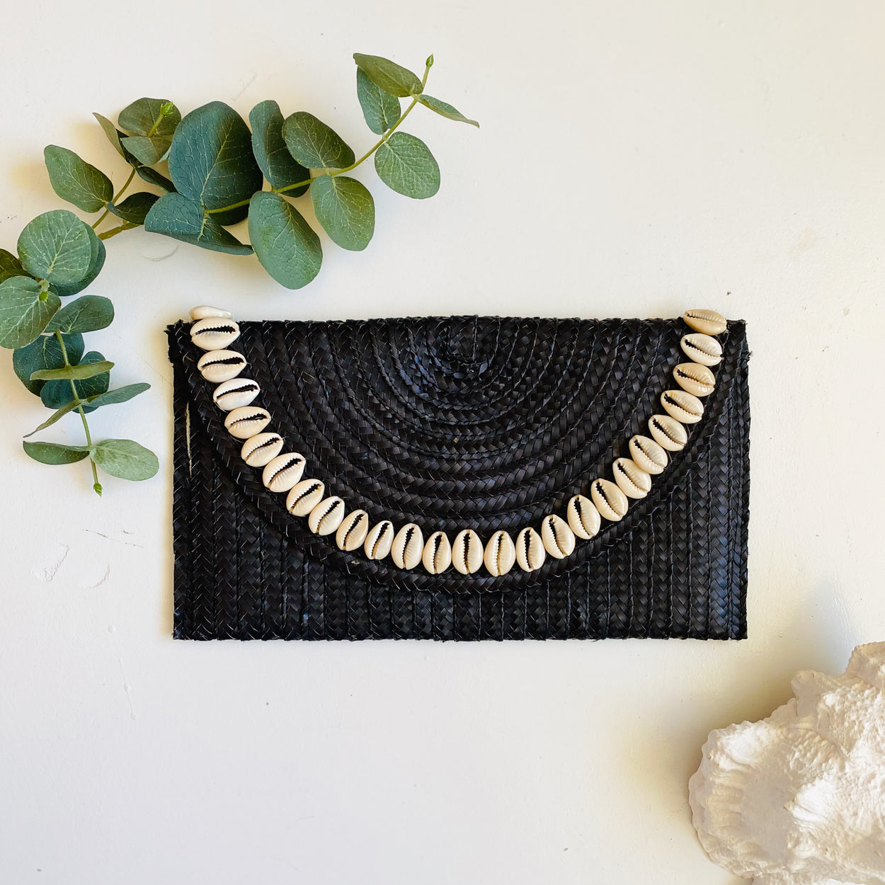 Sandi Cowrie Clutch
