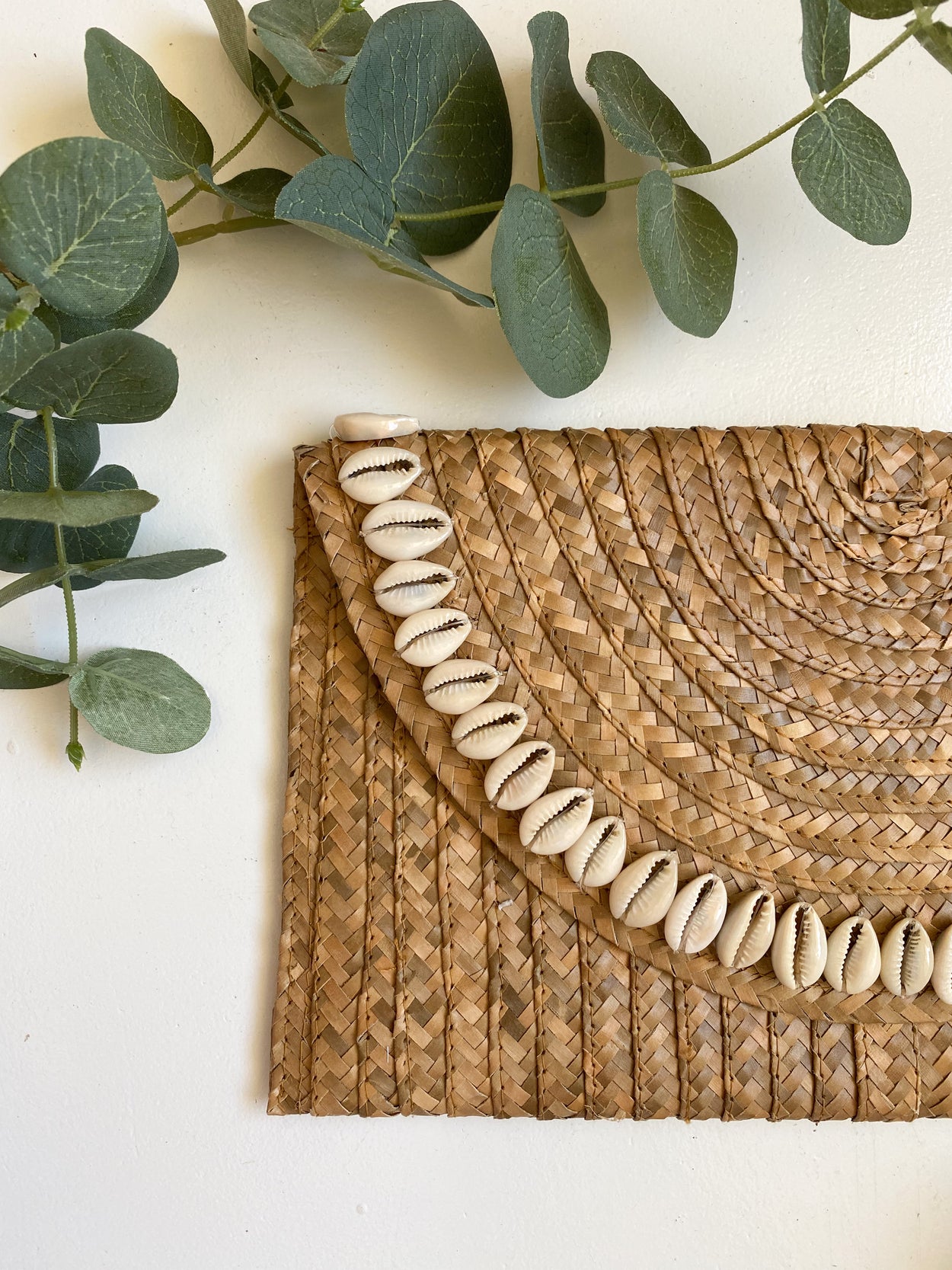 Sandi Cowrie Clutch