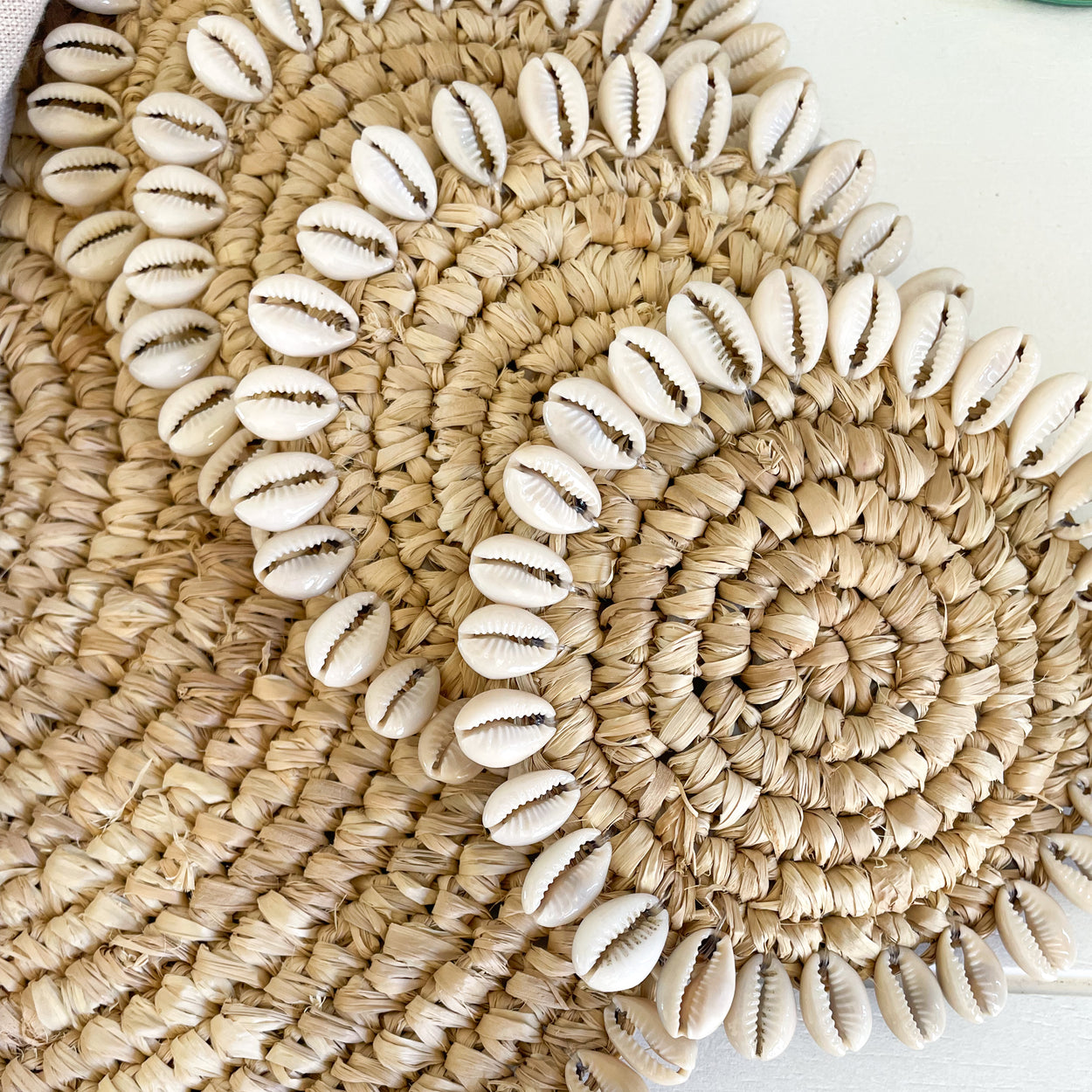 Handwoven Raffia Coasters with cowrie shell trim