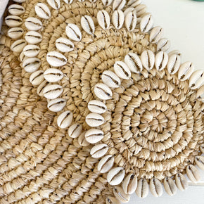Handwoven Raffia Coasters with cowrie shell trim
