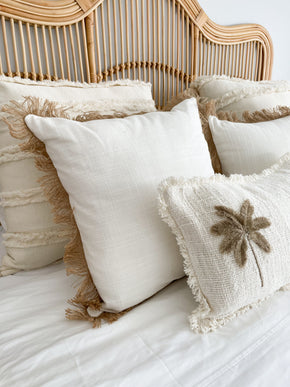 Tropical handmade cushion cover in neutral bedroom
