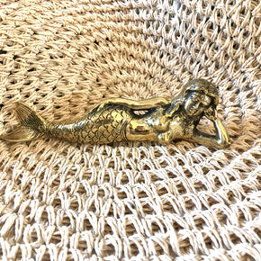 Brass Ariel Mermaid Statue Ornament With Tail laying flat. Coastal Island Luxe Decor